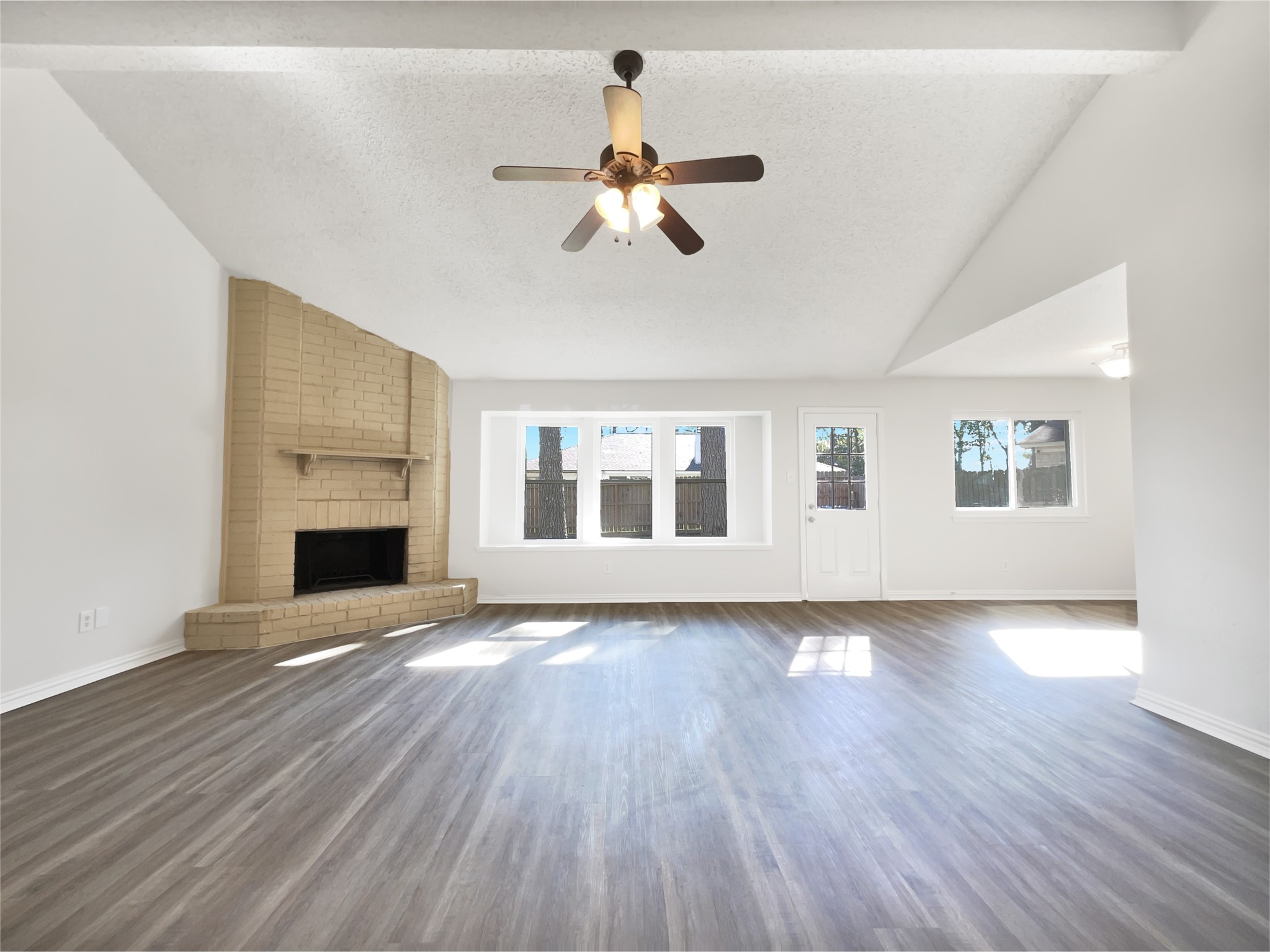 5414 Honeybear Lane Spring, TX 77373 - Photo 3 of 16 a view of empty room with wooden floor fan and window