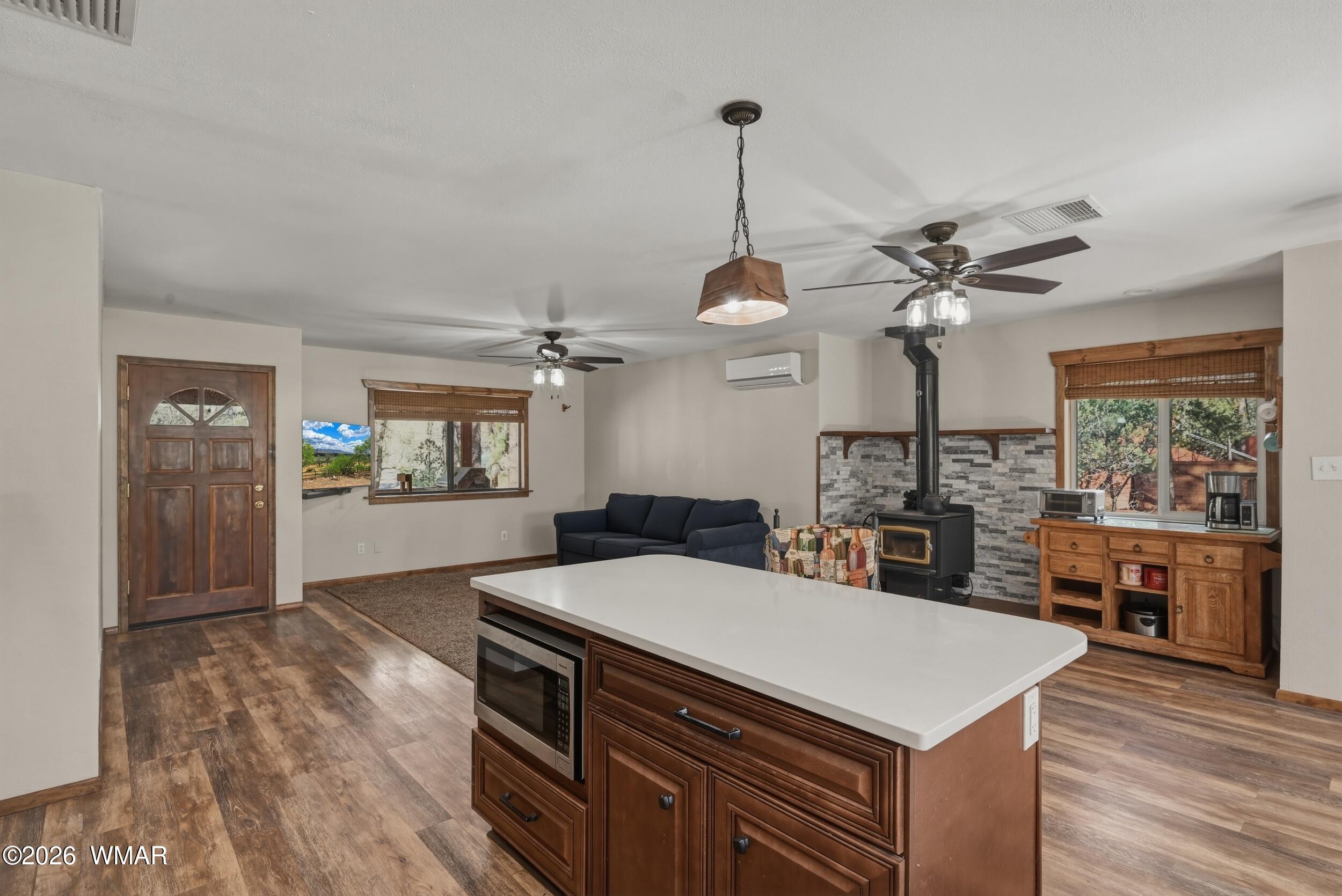 3533 Foothill Road Pine, AZ 85544 - Photo 14 of 52 a kitchen with a sink a stove and chairs