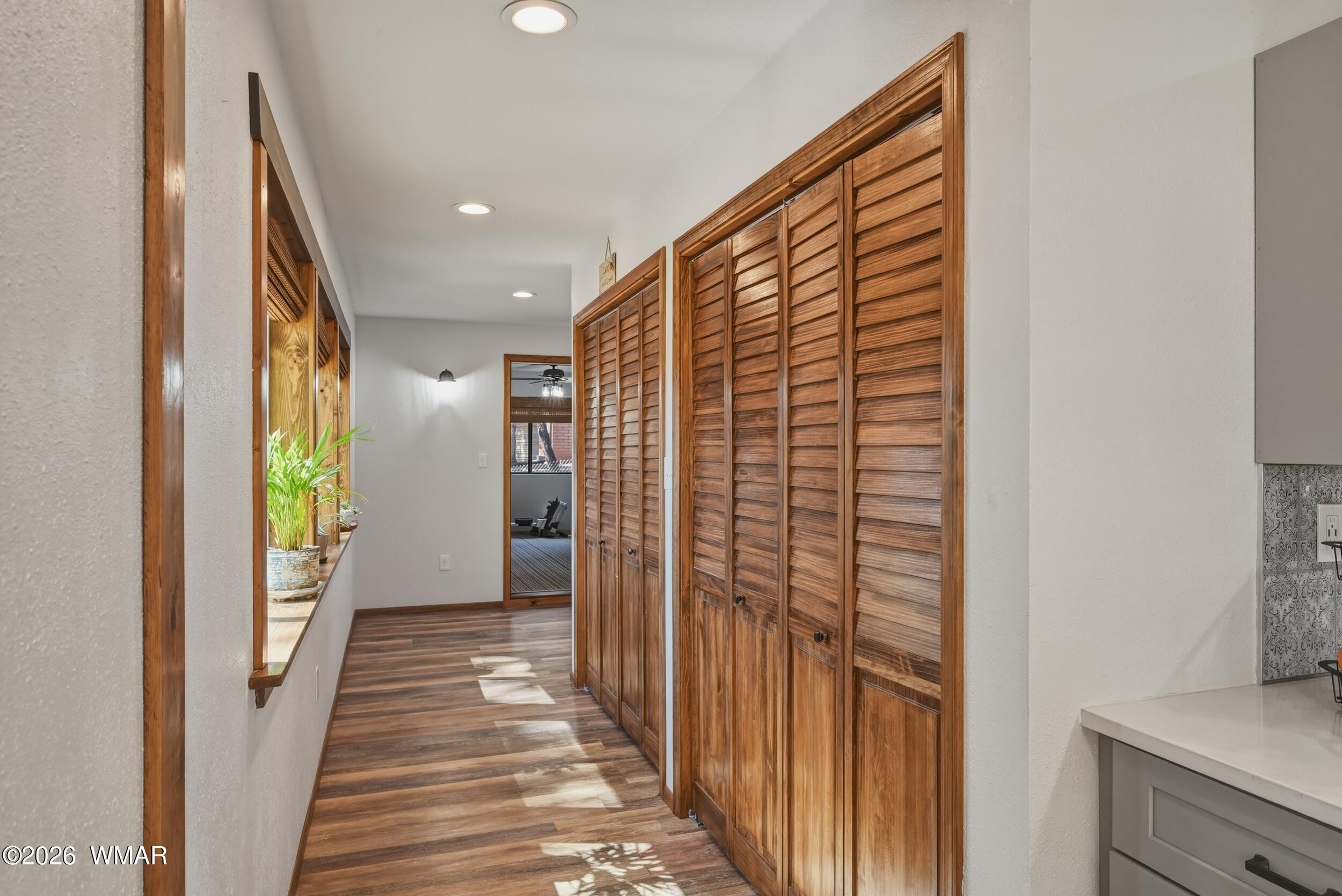 3533 Foothill Road Pine, AZ 85544 - Photo 17 of 52 a view of a hallway with wooden floor and staircase