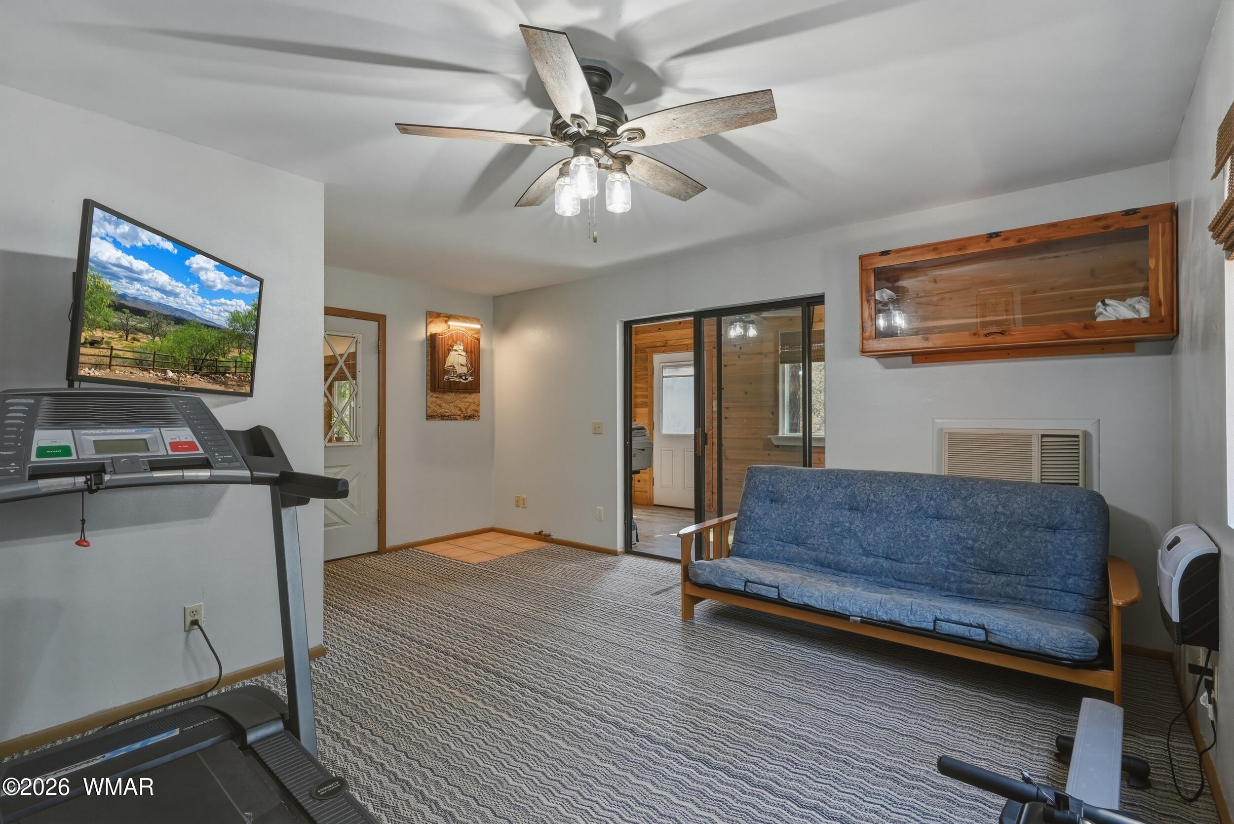 3533 Foothill Road Pine, AZ 85544 - Photo 21 of 52 a living room with furniture and a flat screen tv