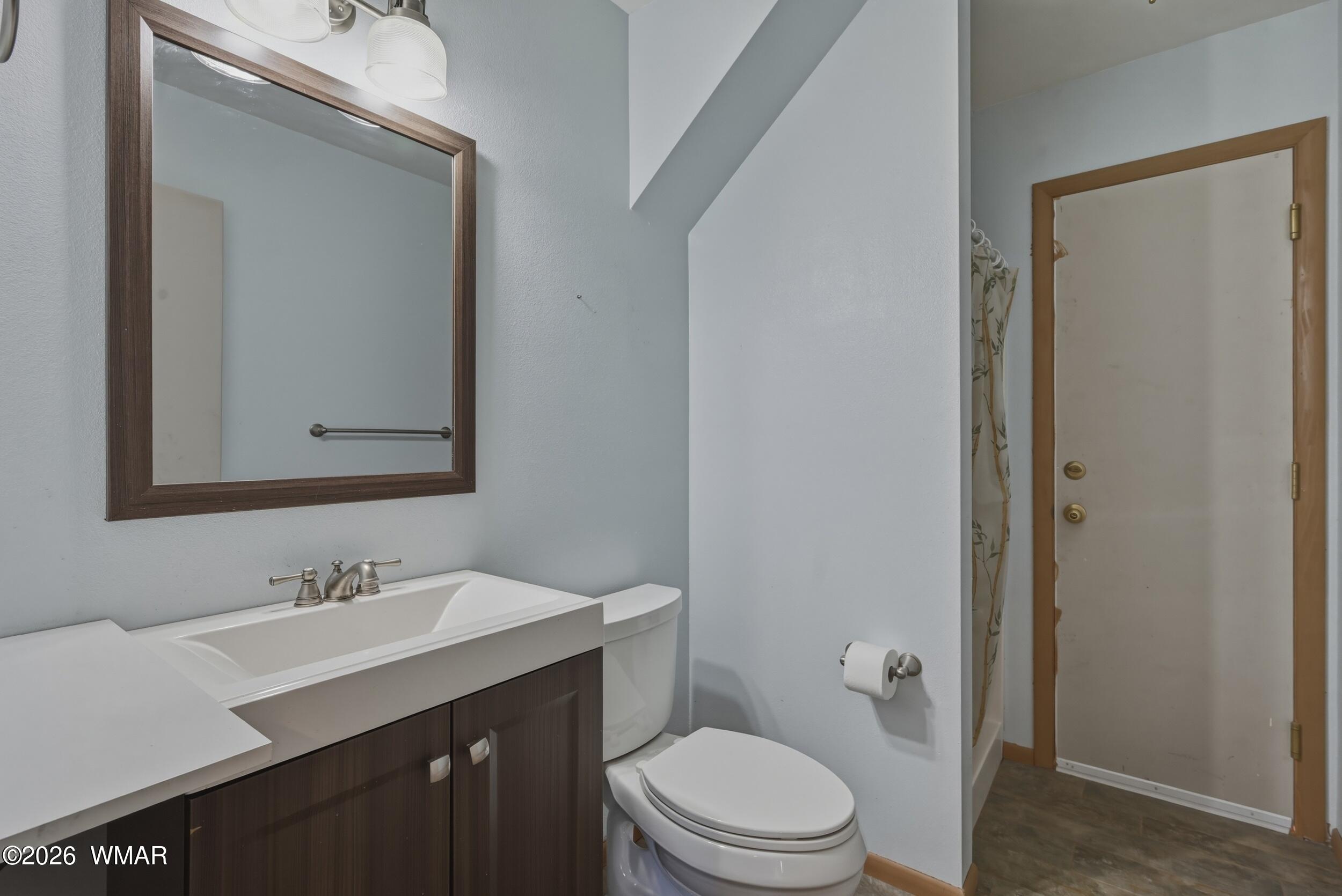 3533 Foothill Road Pine, AZ 85544 - Photo 22 of 52 a bathroom with a sink vanity mirror and toilet