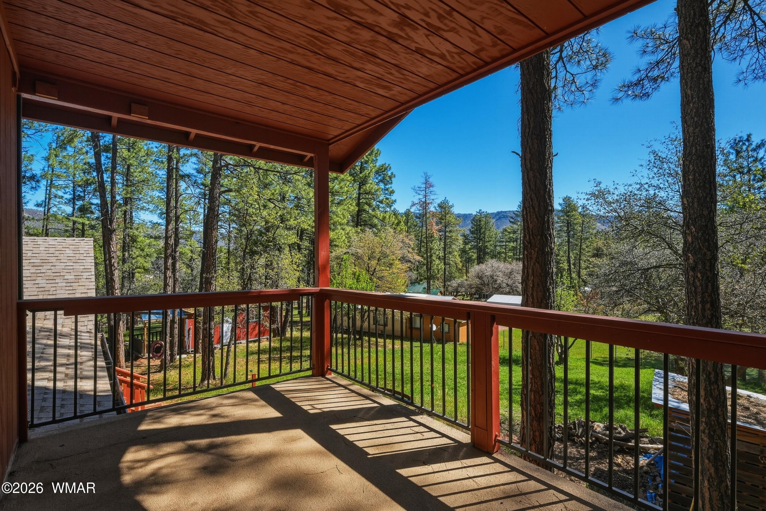 3533 Foothill Road Pine, AZ 85544 - Photo 26 of 52 a view of a wooden deck next to a yard