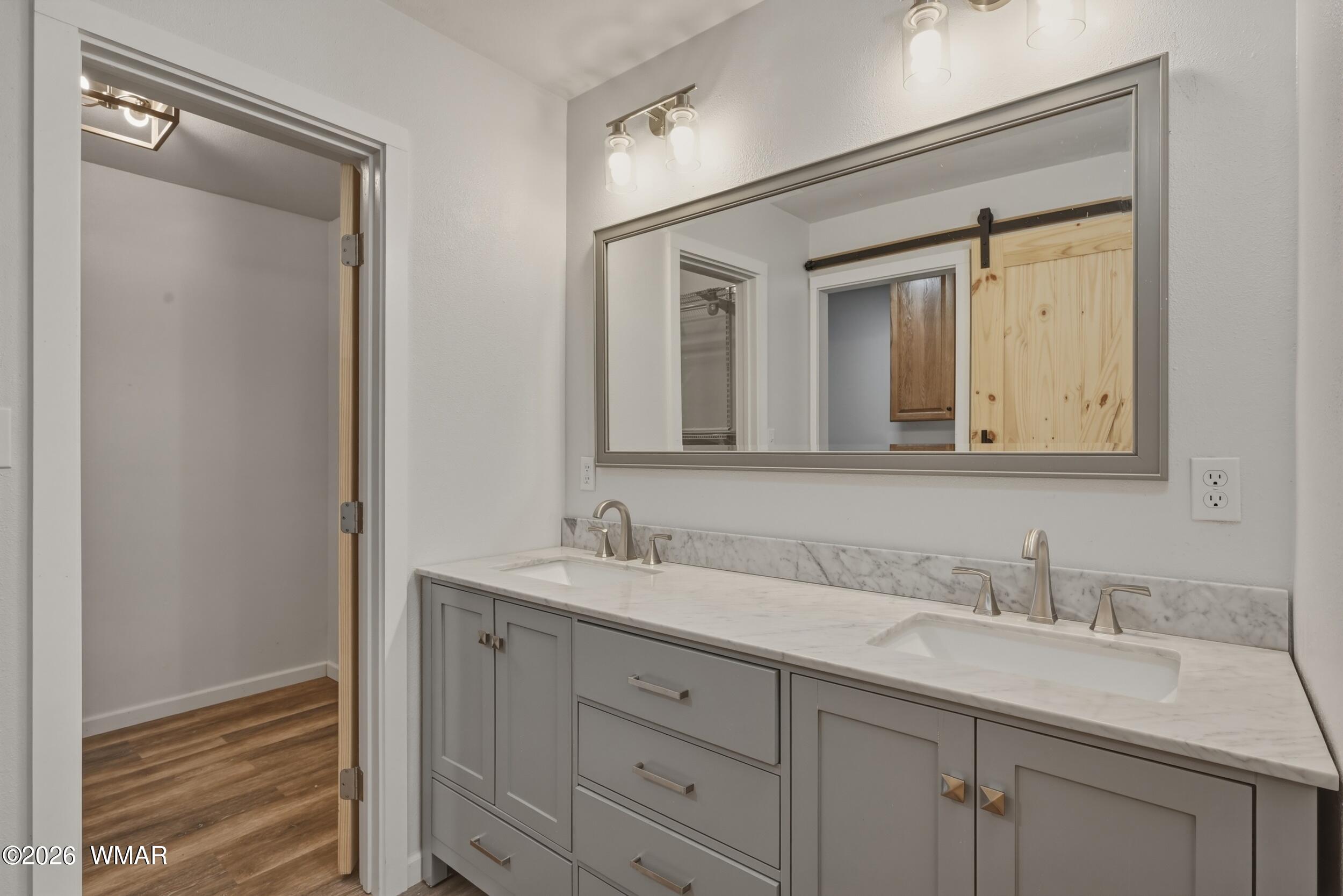 3533 Foothill Road Pine, AZ 85544 - Photo 29 of 52 a bathroom with a double vanity sink and a mirror