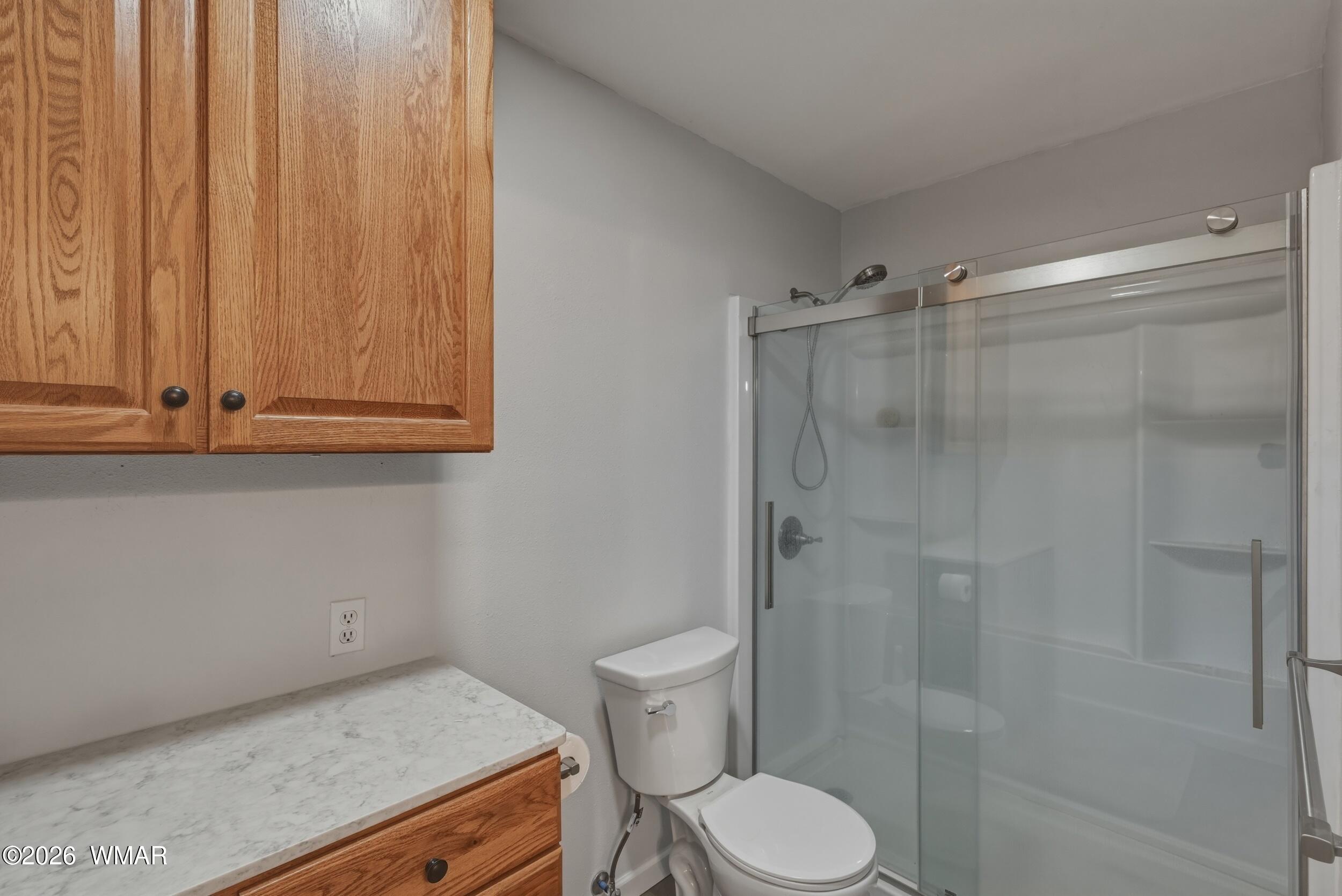 3533 Foothill Road Pine, AZ 85544 - Photo 30 of 52 a bathroom with a sink a toilet and shower