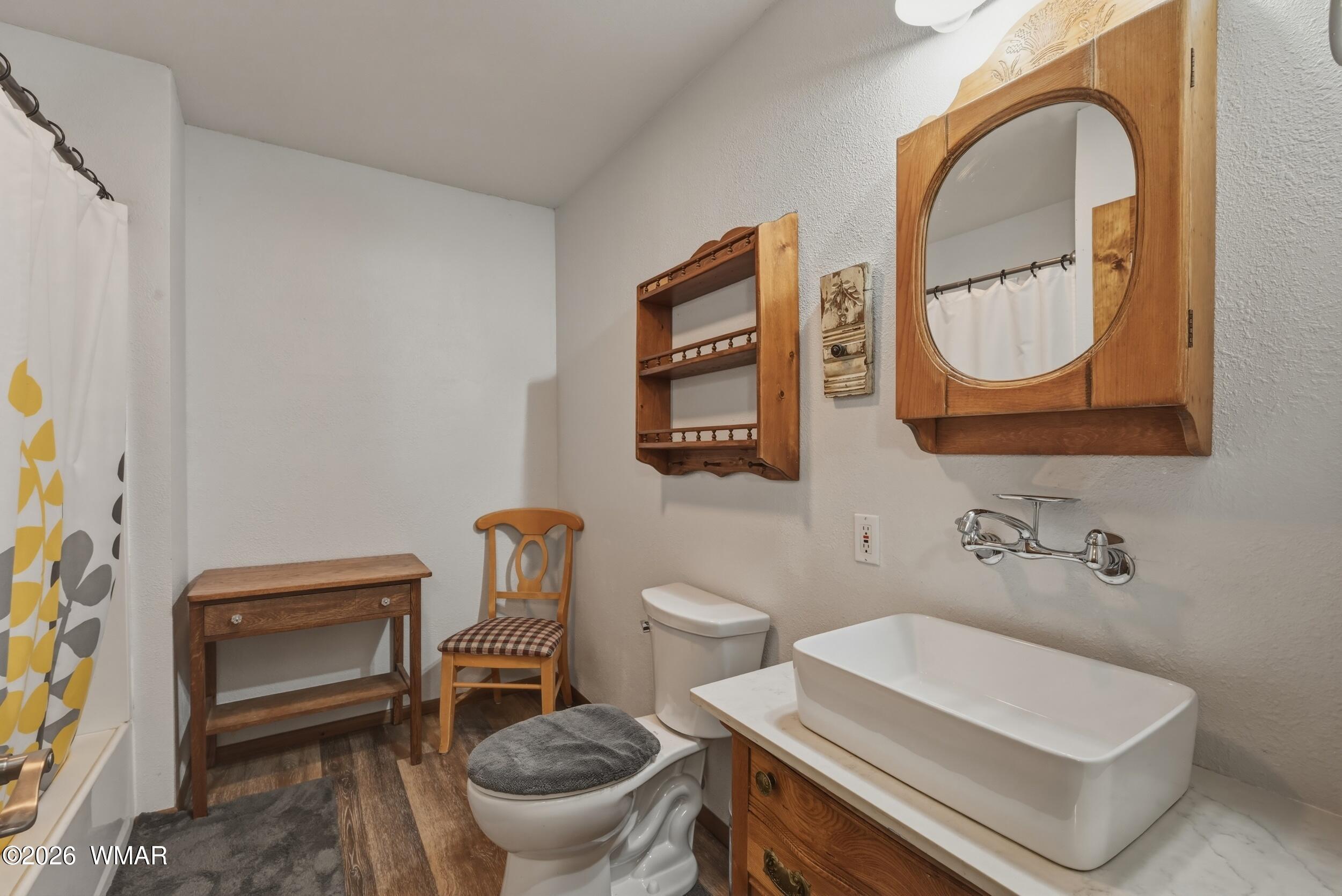 3533 Foothill Road Pine, AZ 85544 - Photo 33 of 52 a bathroom with a toilet a sink and a mirror