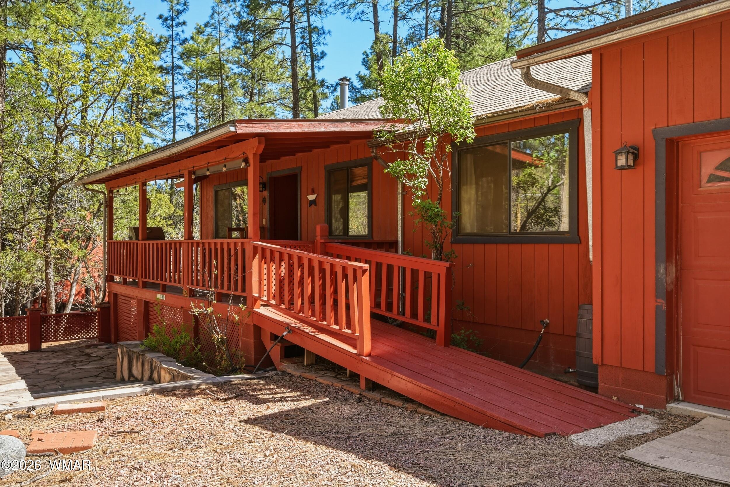 3533 Foothill Road Pine, AZ 85544 - Photo 4 of 52 a view of a house with a small yard and wooden fence