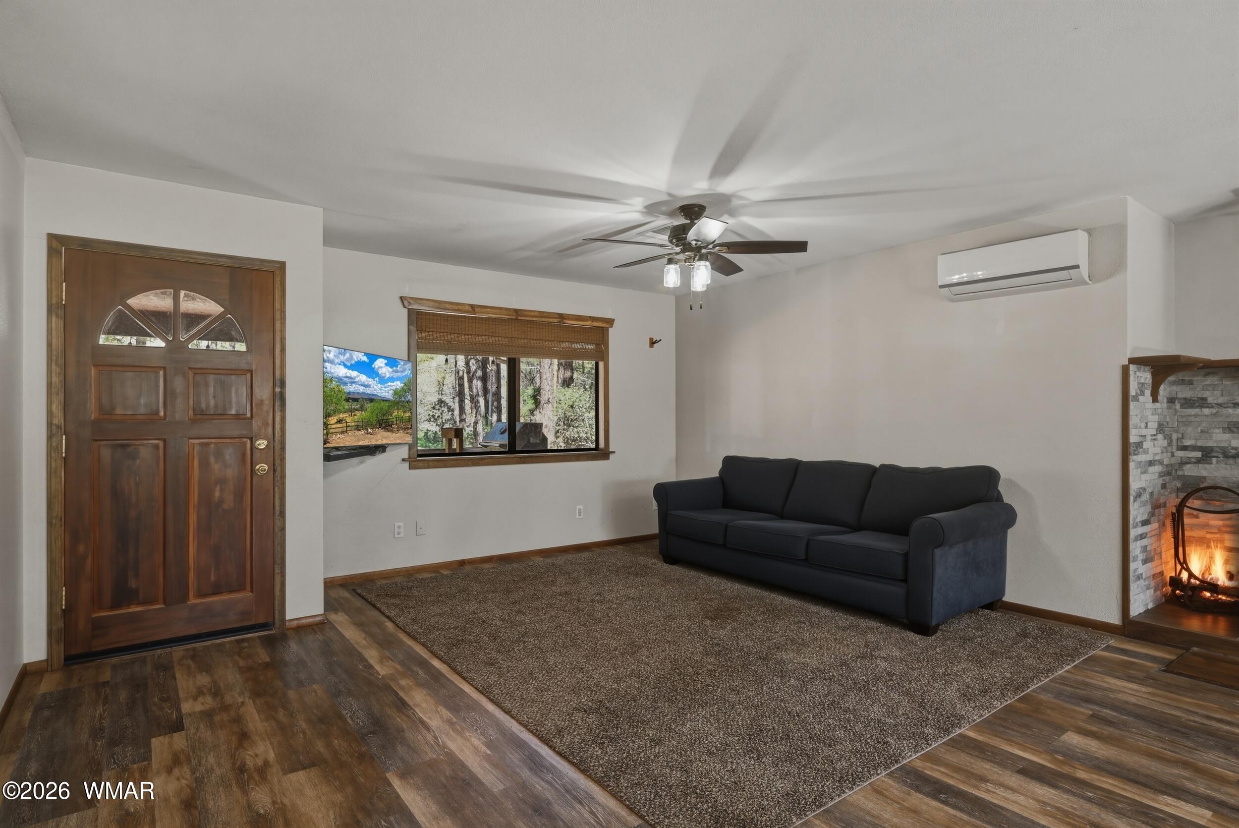 3533 Foothill Road Pine, AZ 85544 - Photo 8 of 52 a living room with furniture and a fireplace