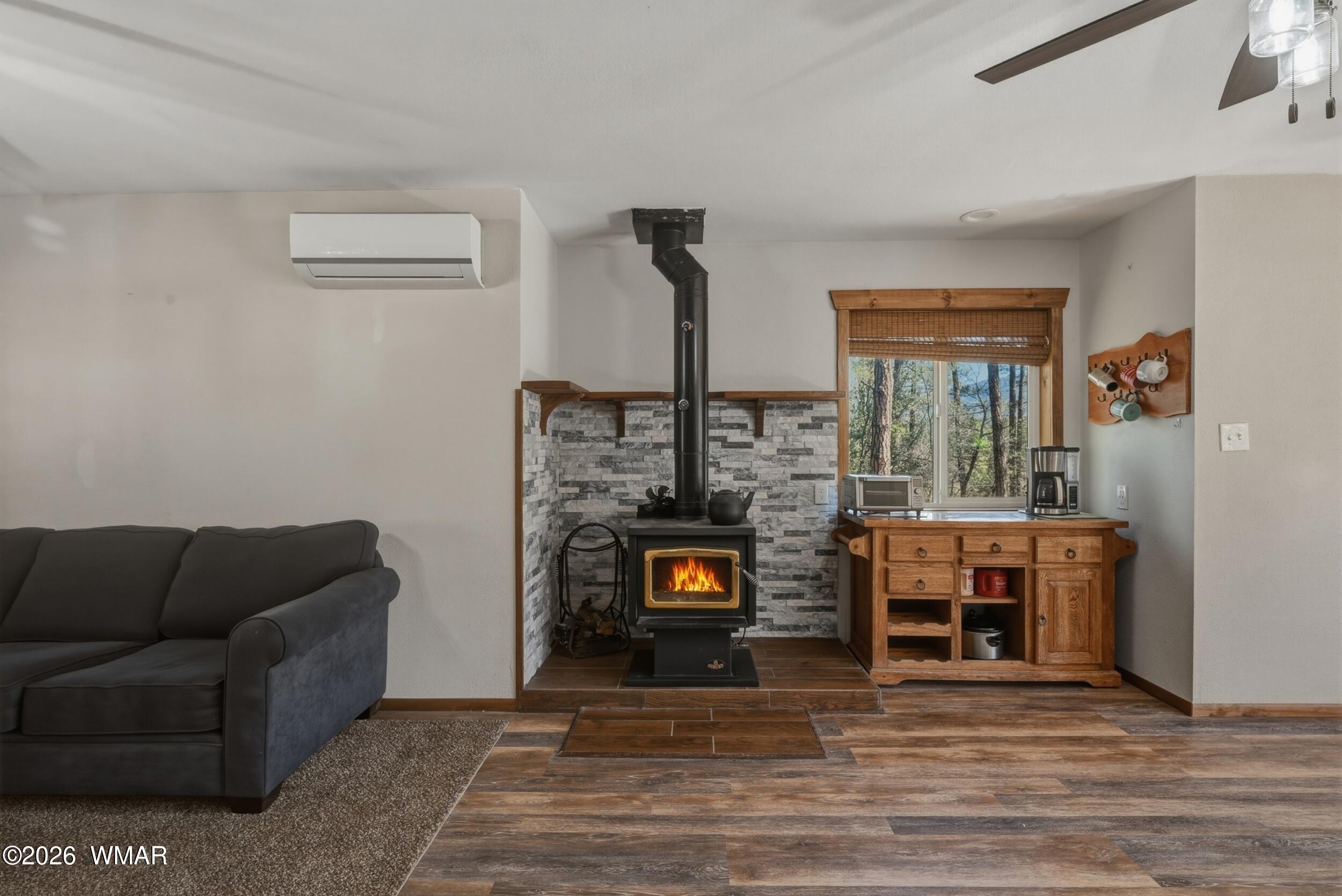 3533 Foothill Road Pine, AZ 85544 - Photo 9 of 52 a living room with furniture and a fireplace