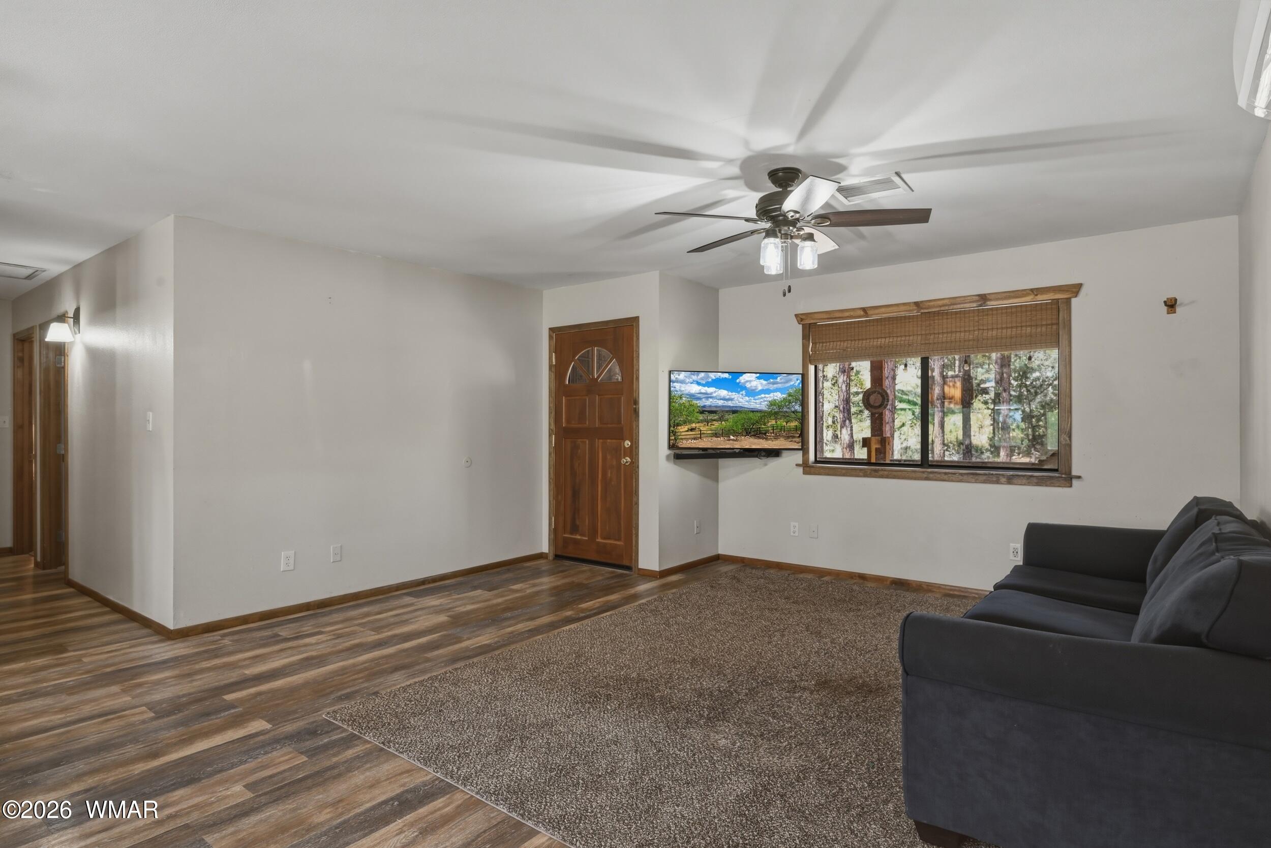 3533 Foothill Road Pine, AZ 85544 - Photo 10 of 52 a living room with furniture and a ceiling fan