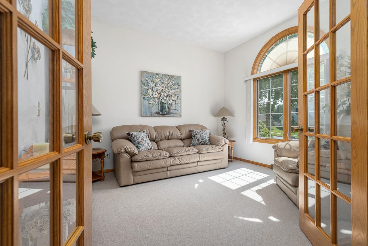 9899 Rambouillet Ridge Roscoe, IL 61073 - Photo 15 of 32 a living room with furniture and a large window