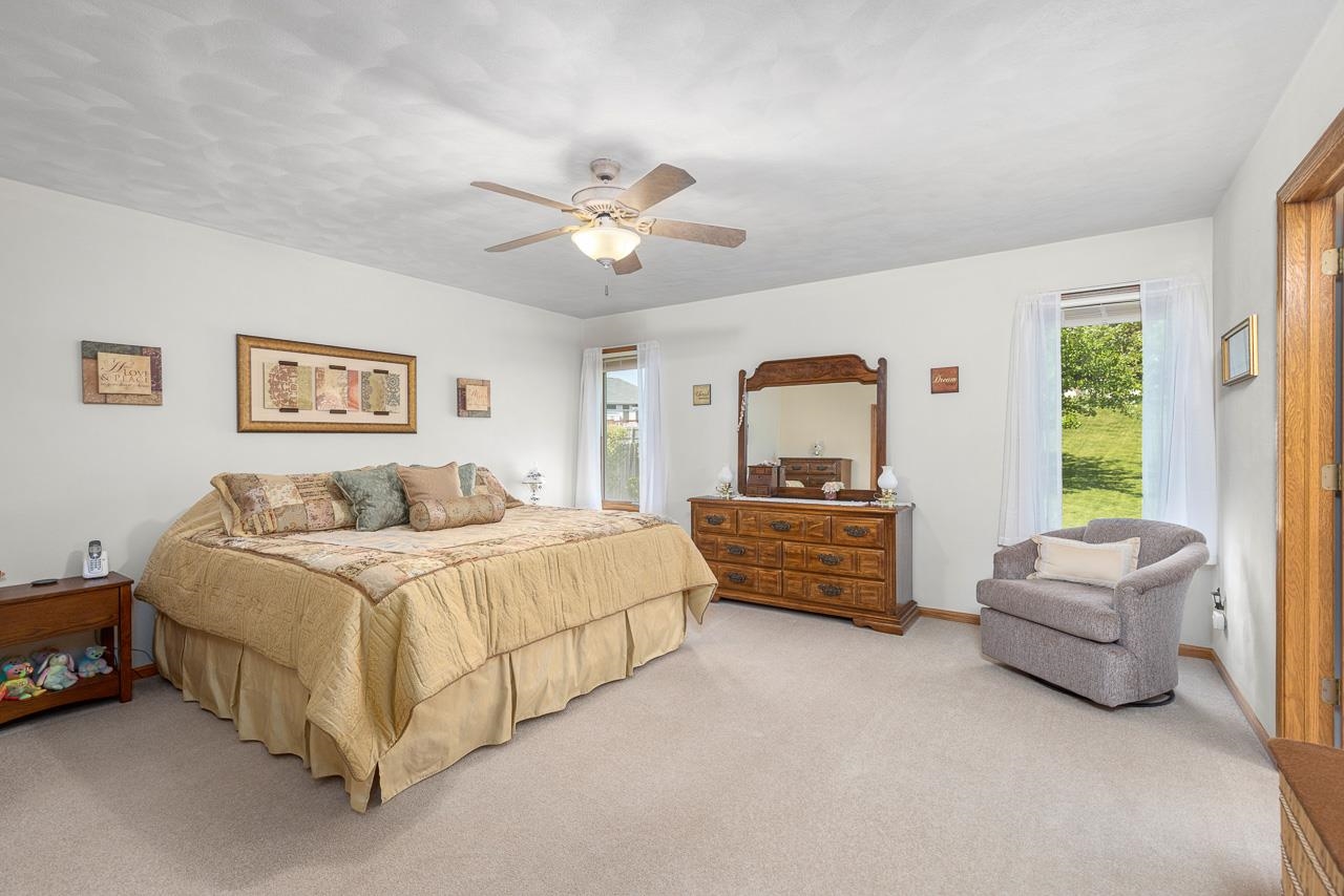 9899 Rambouillet Ridge Roscoe, IL 61073 - Photo 22 of 32 a bed room with a bed and a couch
