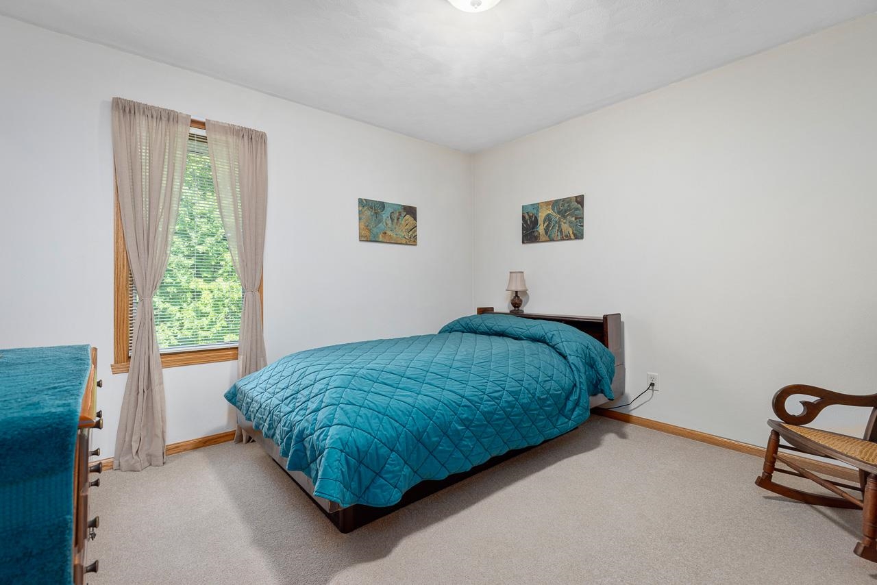 9899 Rambouillet Ridge Roscoe, IL 61073 - Photo 29 of 32 a bedroom with a bed and a window