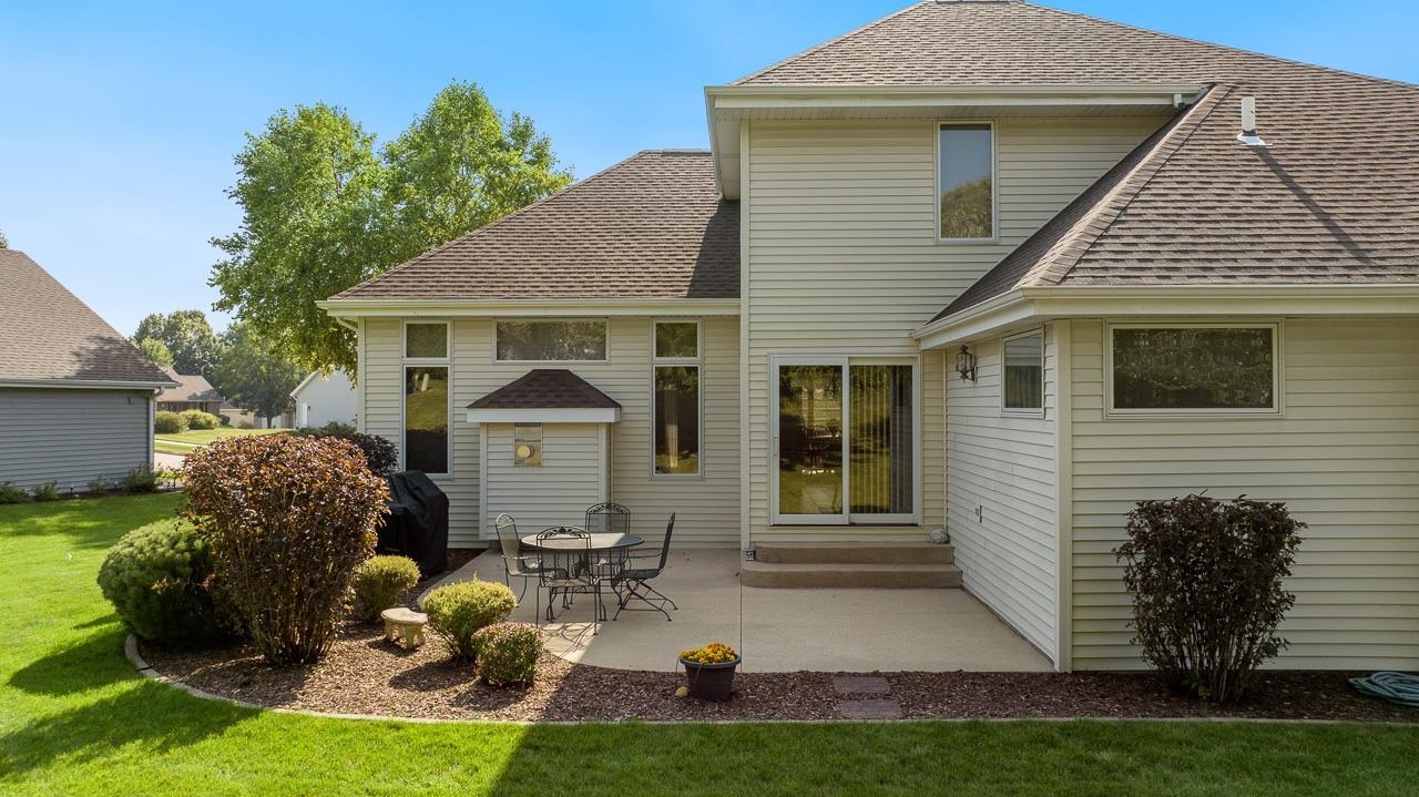 9899 Rambouillet Ridge Roscoe, IL 61073 - Photo 3 of 32 a front view of a house with garden