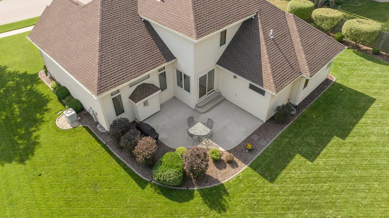 9899 Rambouillet Ridge Roscoe, IL 61073 - Photo 4 of 32 a aerial view of a house with backyard