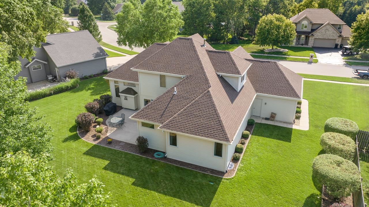 9899 Rambouillet Ridge Roscoe, IL 61073 - Photo 6 of 32 an aerial view of a house with swimming pool garden and mountain view in back