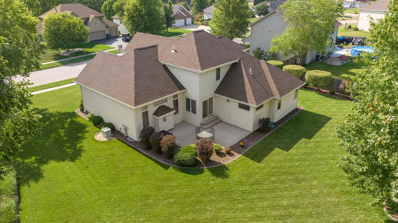 9899 Rambouillet Ridge Roscoe, IL 61073 - Photo 7 of 32 a aerial view of a house with swimming pool