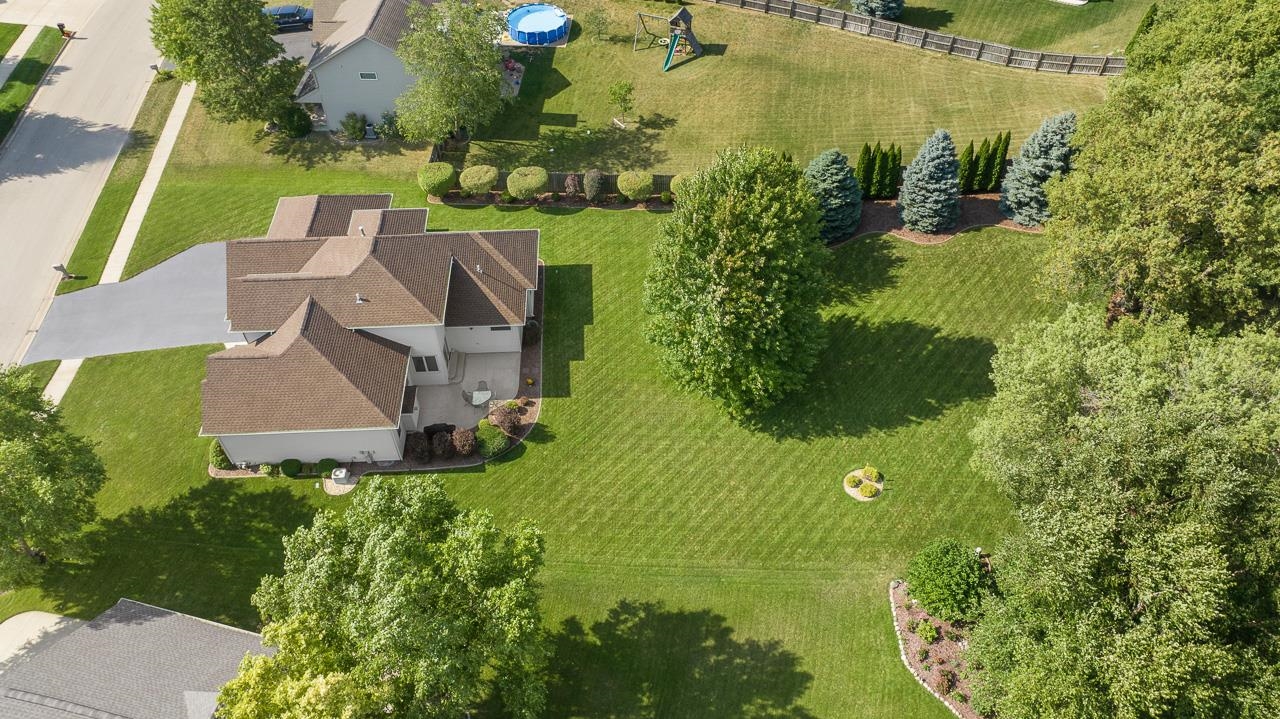 9899 Rambouillet Ridge Roscoe, IL 61073 - Photo 9 of 32 an aerial view of residential house with an outdoor space