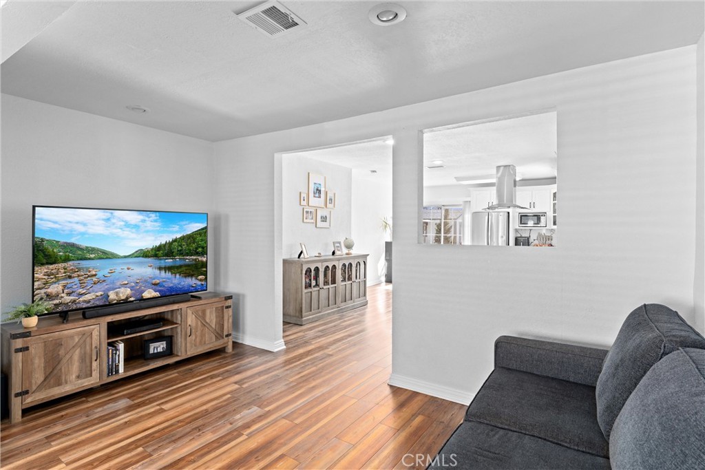14508 Corlett Avenue Compton, CA 90220 - Photo 12 of 47 a living room with furniture and a flat screen tv