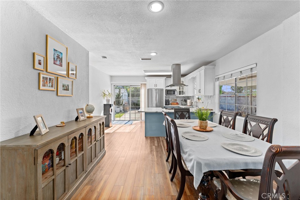 14508 Corlett Avenue Compton, CA 90220 - Photo 13 of 47 a view of a dining room with furniture window and wooden floor