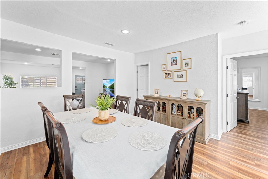 14508 Corlett Avenue Compton, CA 90220 - Photo 15 of 47 a view of a dining room with furniture and wooden floor