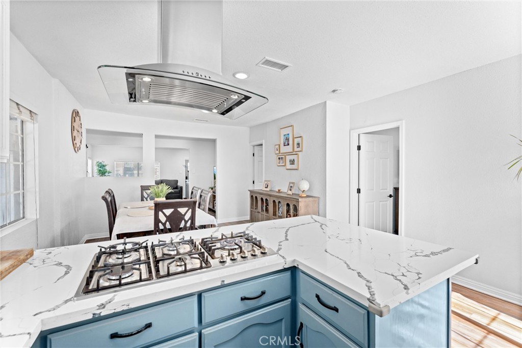 14508 Corlett Avenue Compton, CA 90220 - Photo 19 of 47 a kitchen with a stove cabinets and wooden floor