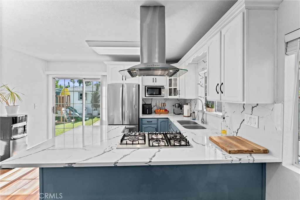 14508 Corlett Avenue Compton, CA 90220 - Photo 20 of 47 a kitchen with stainless steel appliances granite countertop a stove and a refrigerator