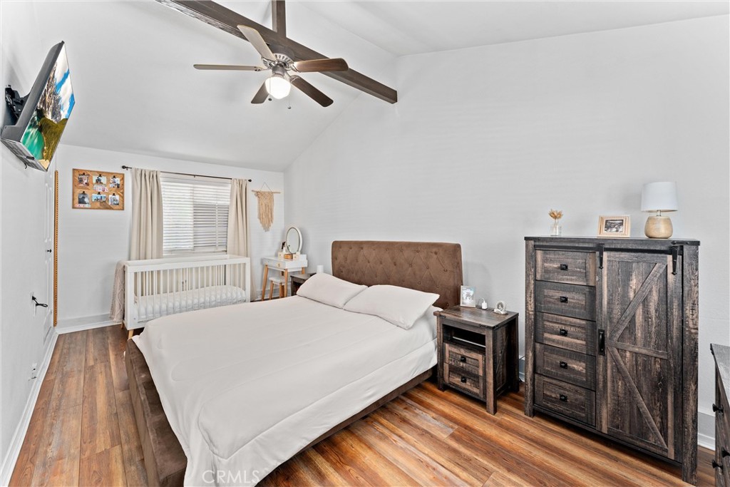 14508 Corlett Avenue Compton, CA 90220 - Photo 24 of 47 a bedroom with a bed and a chandelier