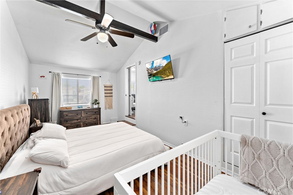 14508 Corlett Avenue Compton, CA 90220 - Photo 25 of 47 a bedroom with a bed and a chandelier