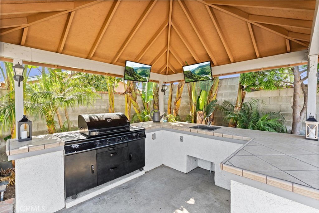 14508 Corlett Avenue Compton, CA 90220 - Photo 42 of 47 a kitchen with a sink a stove and a microwave