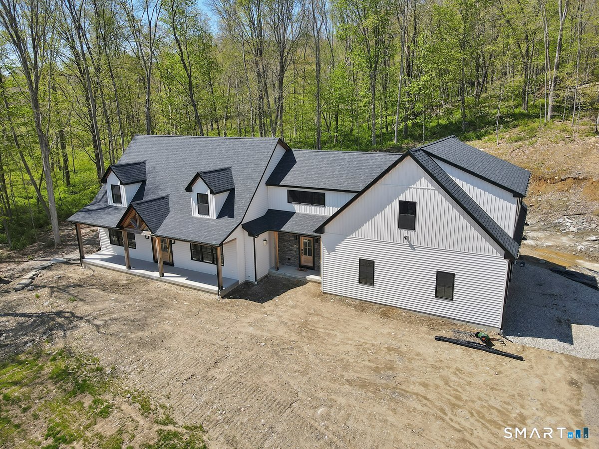 106 South Street Extension Coventry, CT 06238 - Photo 28 of 33 a view of a white house with a large trees