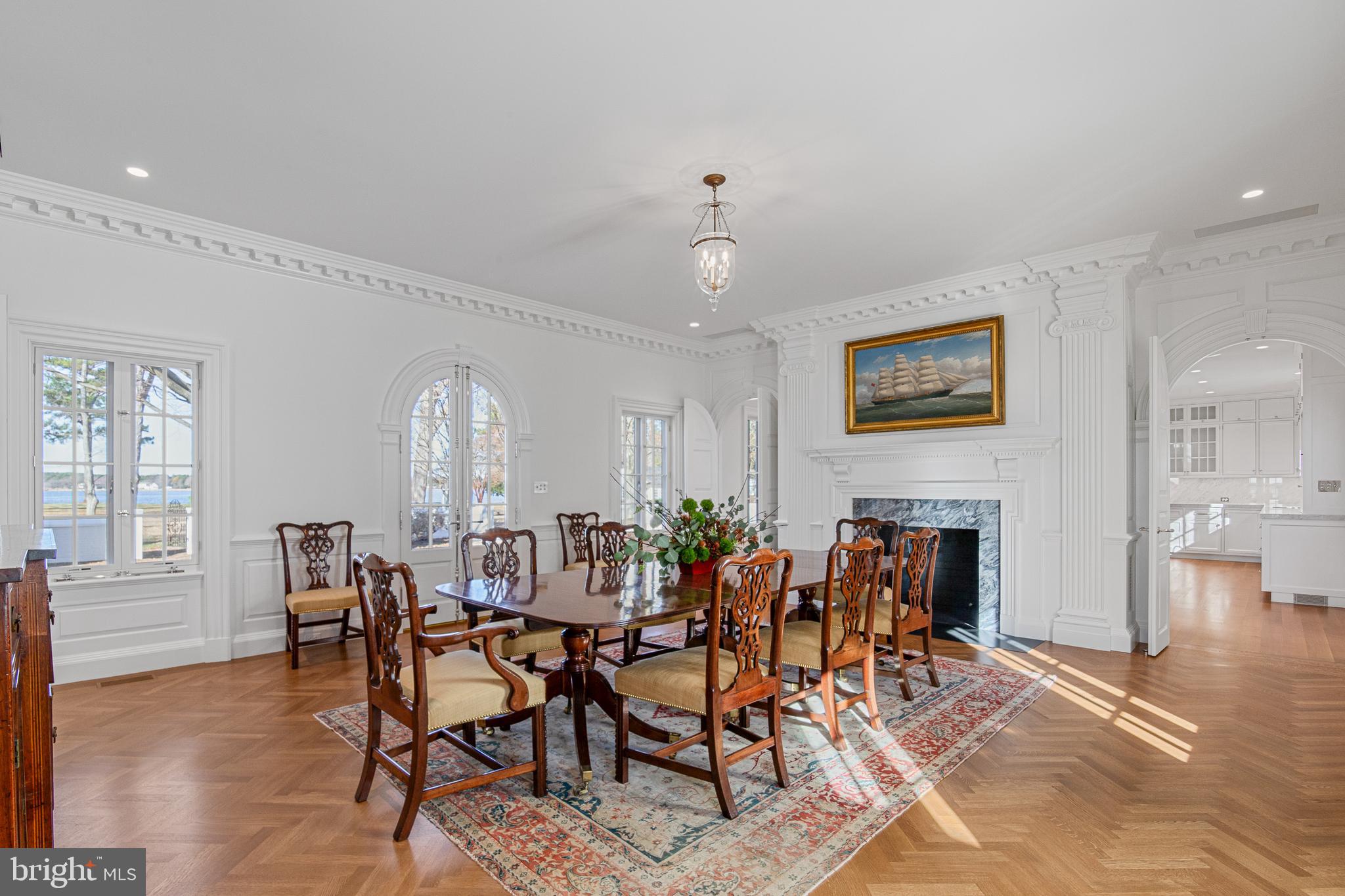 6010 Shipyard Lane Easton, MD 21601 - Photo 20 of 71 a view of a dining room with furniture window and wooden floor