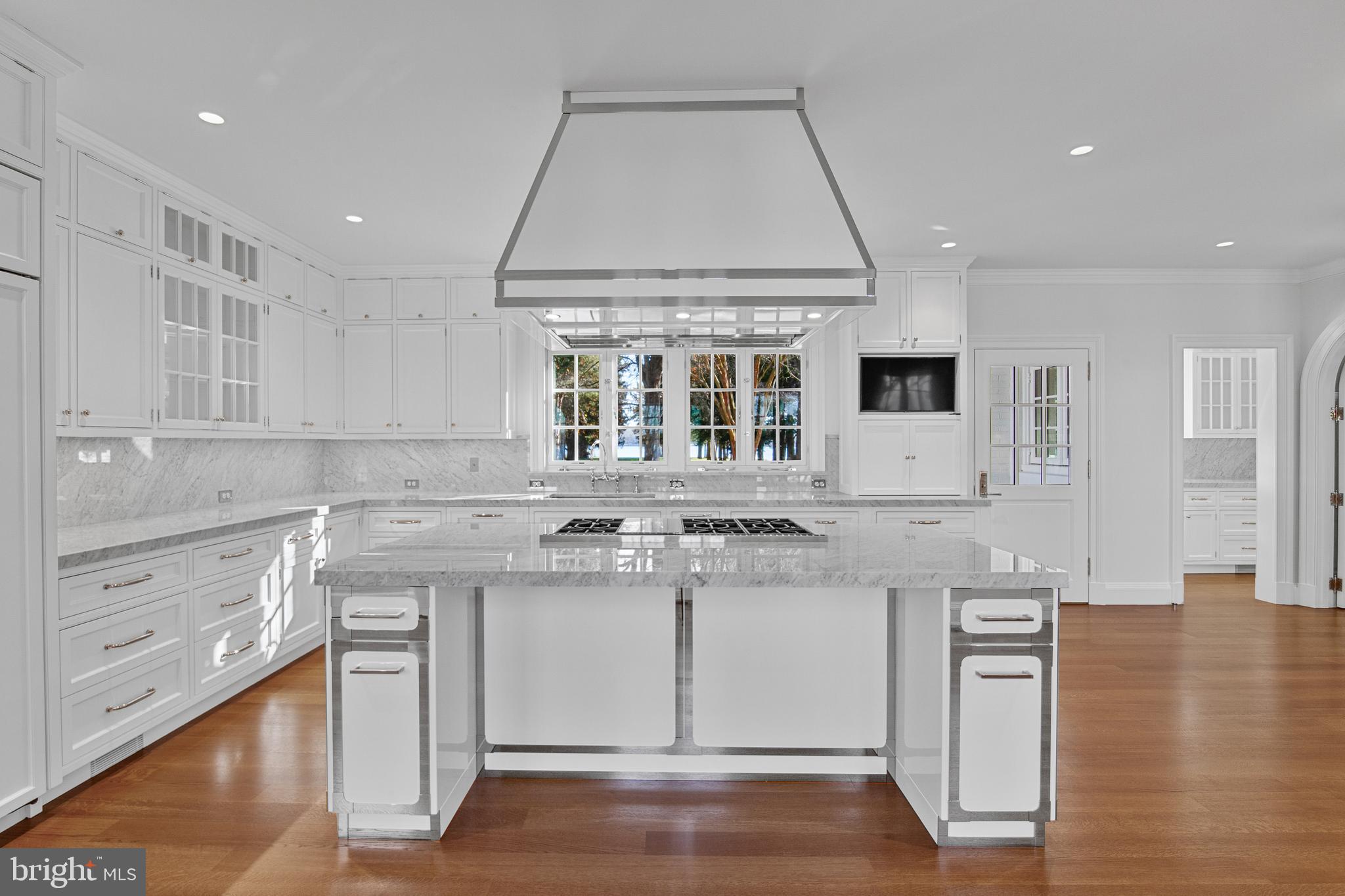 6010 Shipyard Lane Easton, MD 21601 - Photo 24 of 71 a kitchen with stainless steel appliances granite countertop a stove and more cabinets