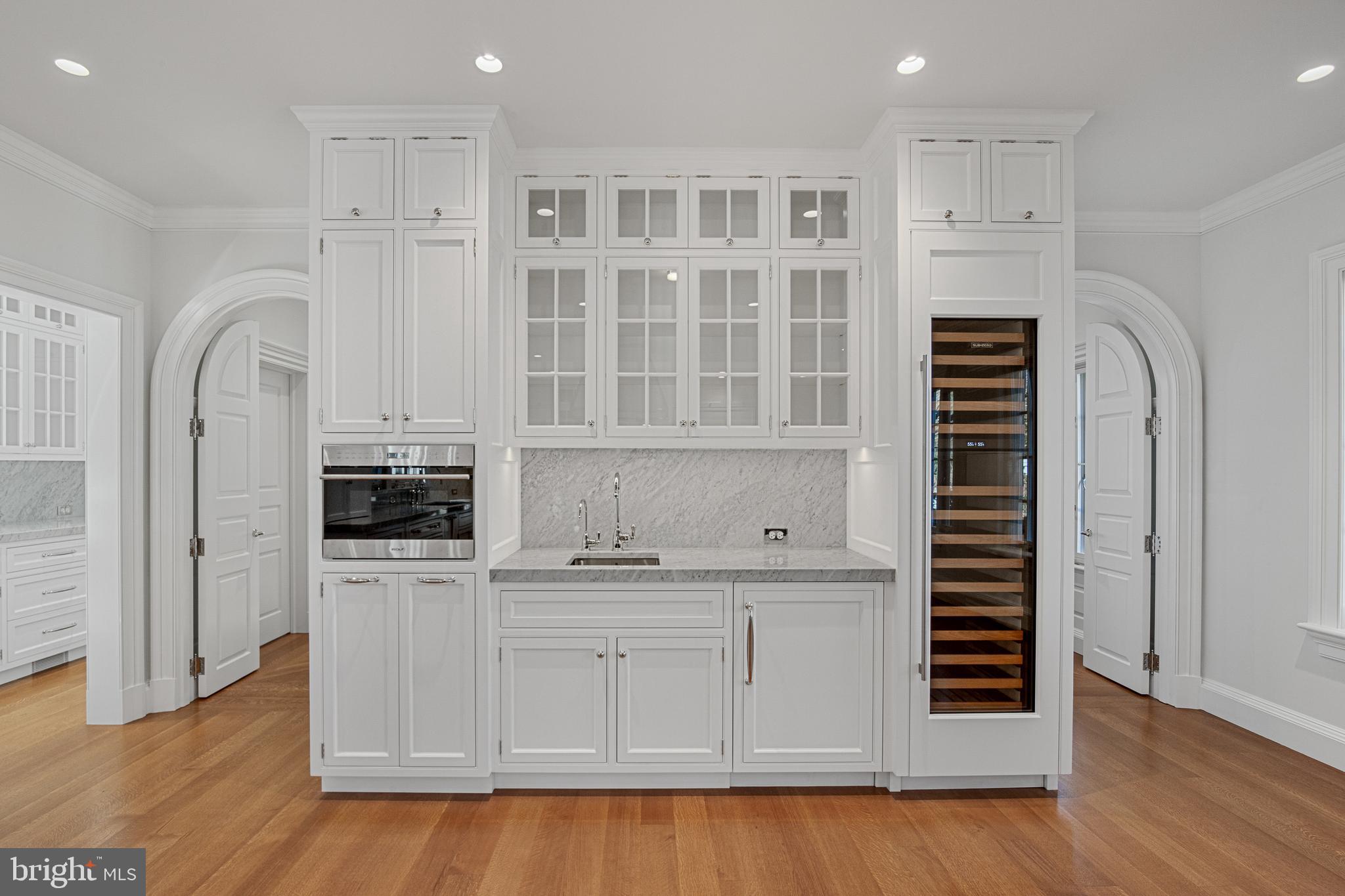 6010 Shipyard Lane Easton, MD 21601 - Photo 26 of 71 a kitchen with stainless steel appliances a stove and cabinets