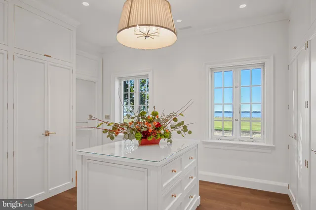 a bathroom with a granite countertop sink a toilet and a mirror