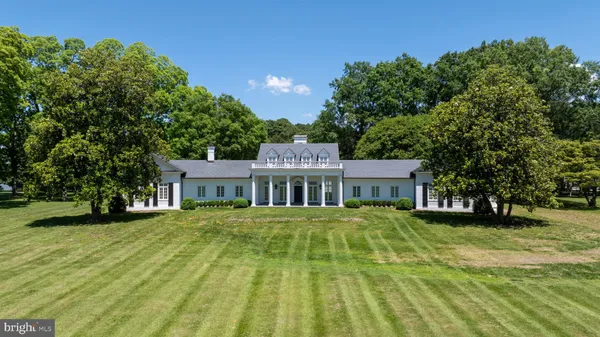 a view of a lake with houses in back