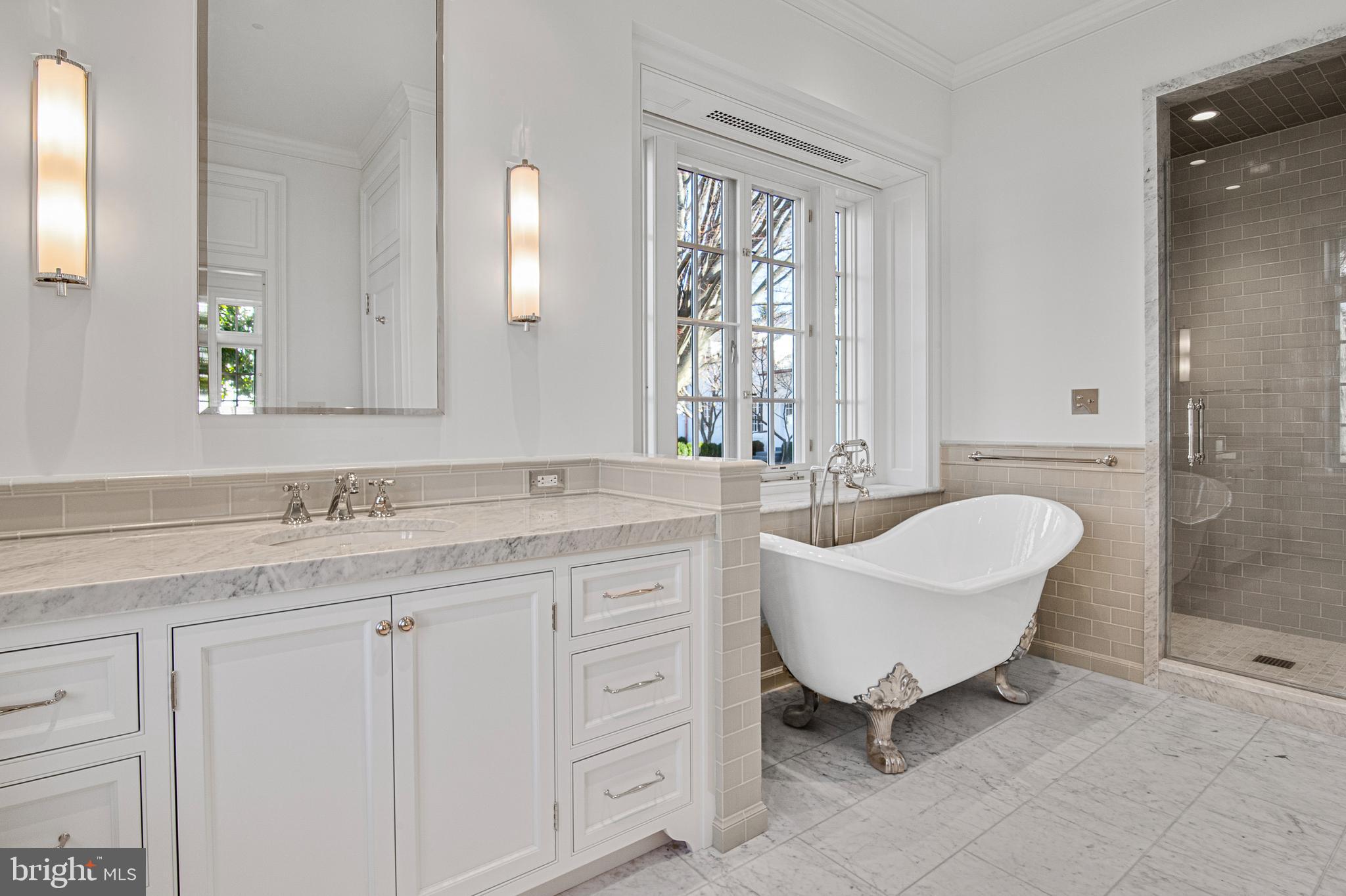 6010 Shipyard Lane Easton, MD 21601 - Photo 47 of 71 a bathroom with a granite countertop sink a toilet and a mirror