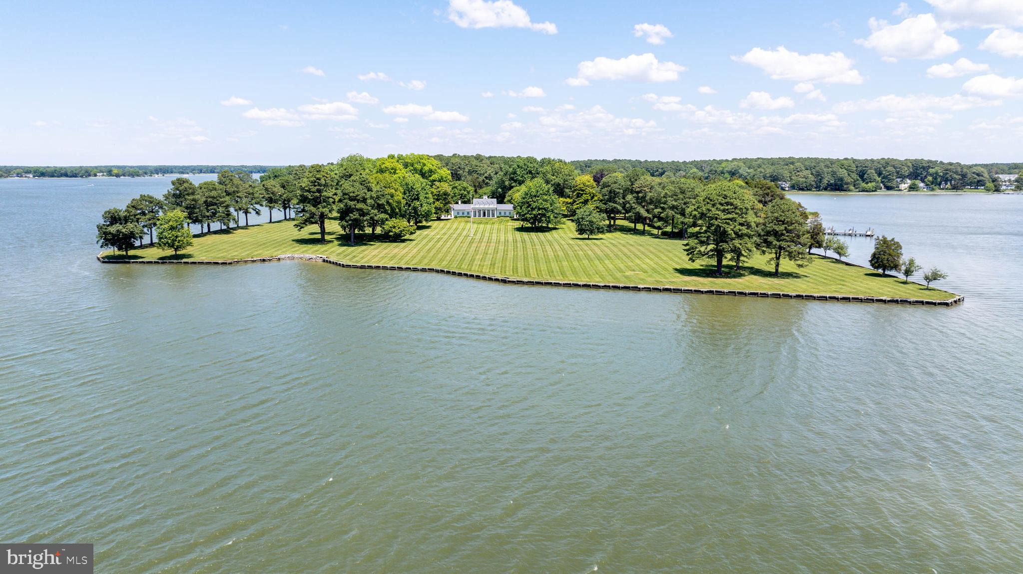 6010 Shipyard Lane Easton, MD 21601 - Photo 6 of 71 a view of a lake with houses in back
