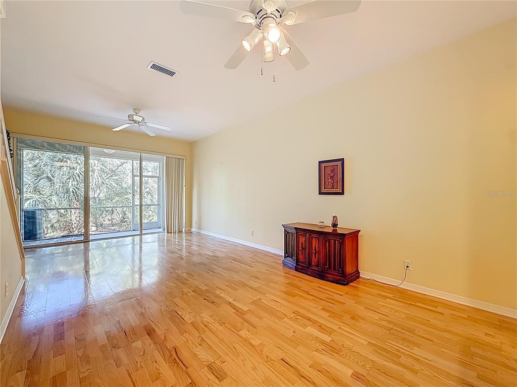 3589 Country Pointe Place Palm Harbor, FL 34684 - Photo 12 of 31 a room with natural light and wooden floor