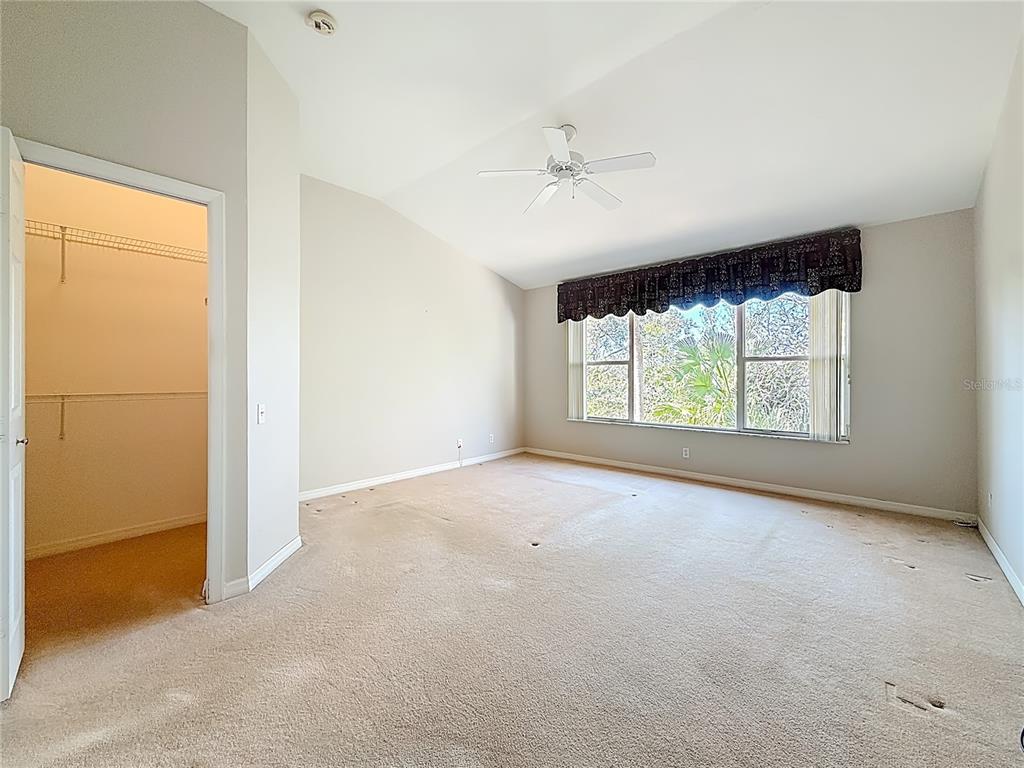 3589 Country Pointe Place Palm Harbor, FL 34684 - Photo 17 of 31 an empty room with windows and closet