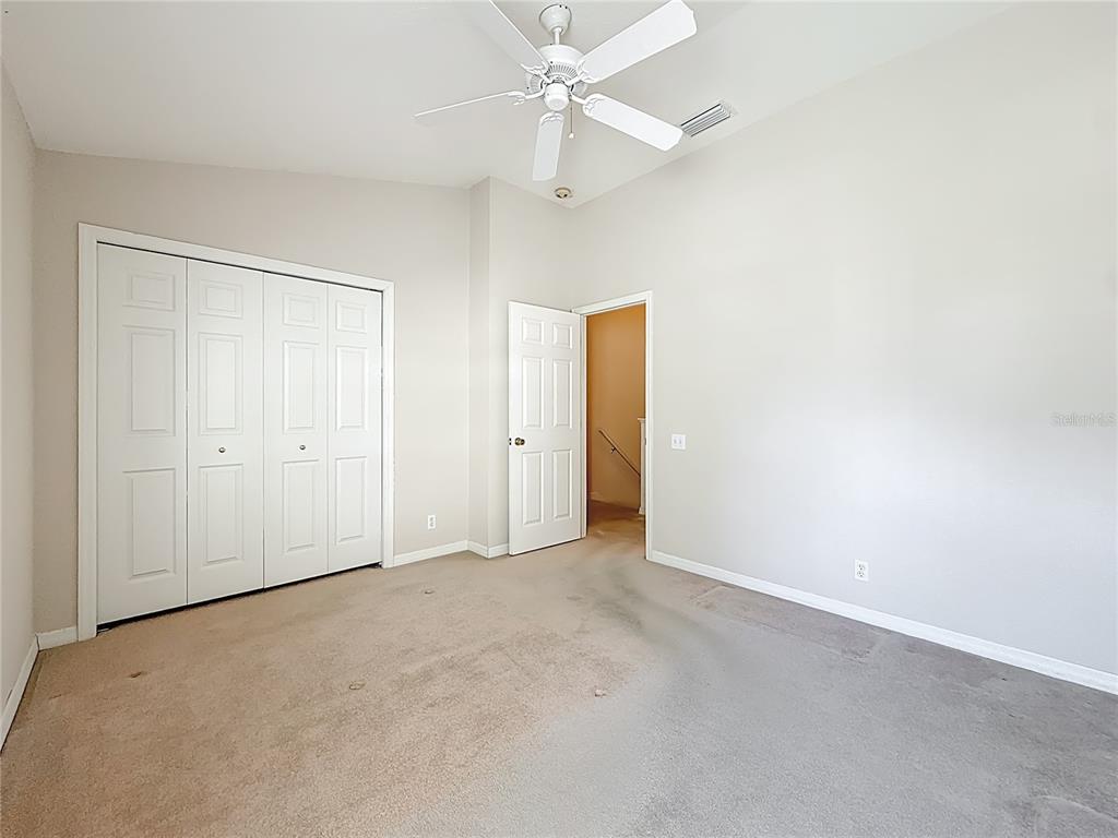 3589 Country Pointe Place Palm Harbor, FL 34684 - Photo 21 of 31 an empty room with a ceiling fan and a window