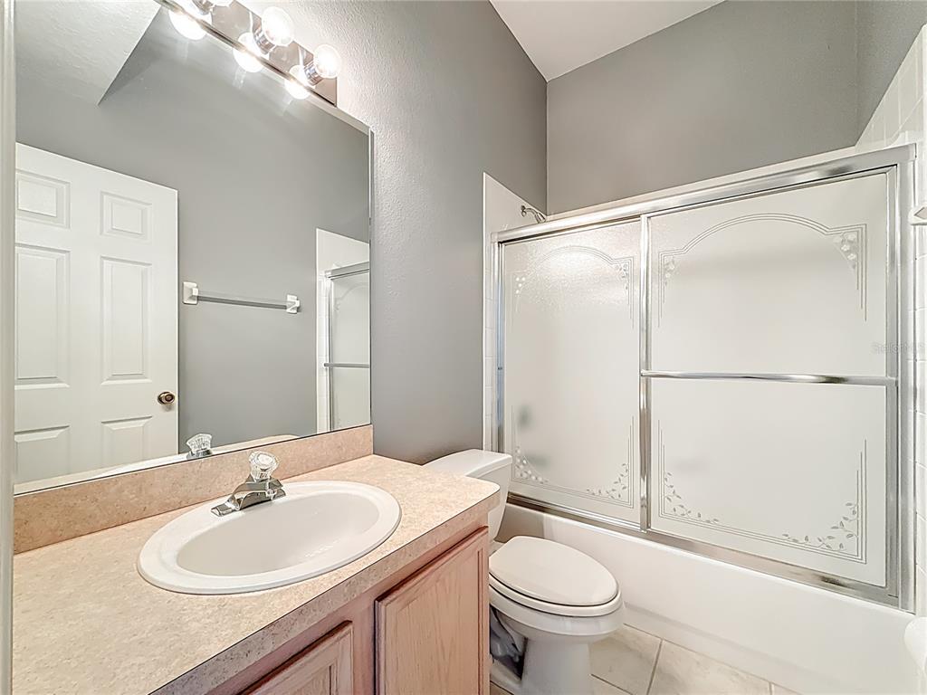 3589 Country Pointe Place Palm Harbor, FL 34684 - Photo 22 of 31 a bathroom with a sink toilet and shower