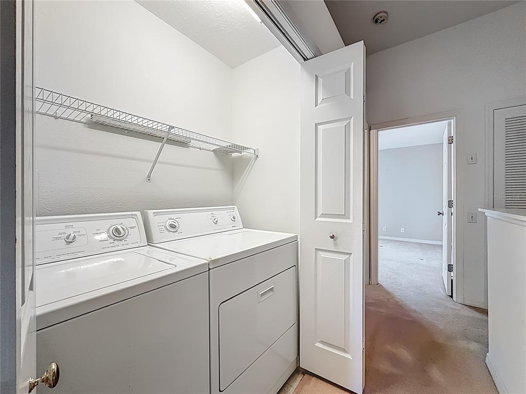 3589 Country Pointe Place Palm Harbor, FL 34684 - Photo 23 of 31 a utility room with dryer and washer