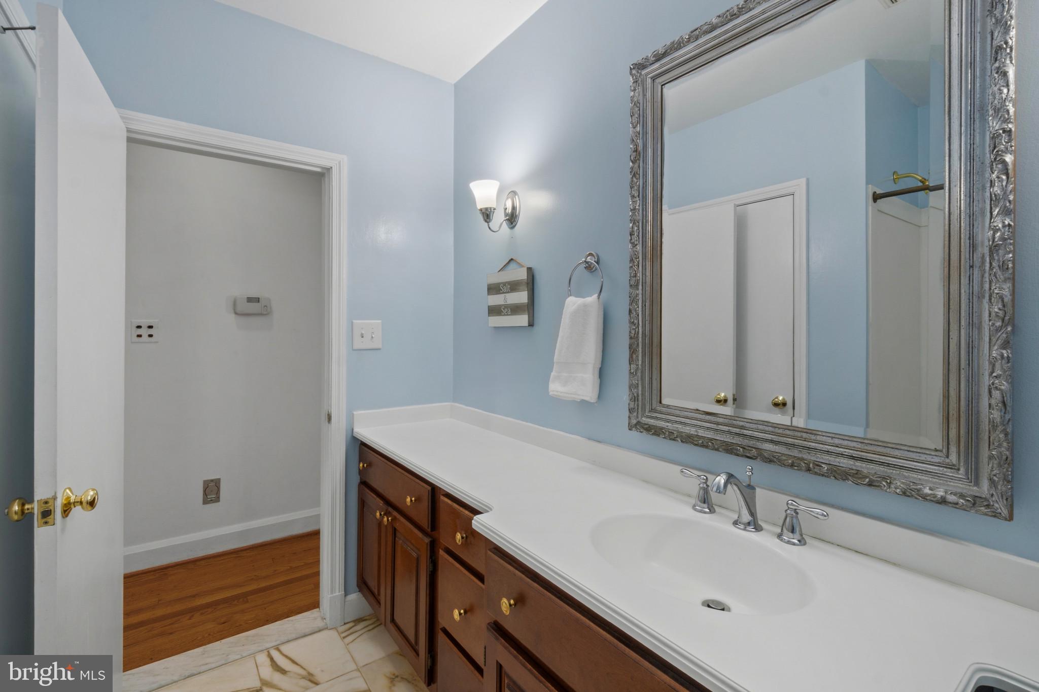 909 Weatherbee Road Towson, MD 21286 - Photo 29 of 51 a bathroom with a sink and a mirror