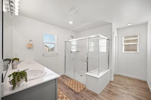 a bathroom with a sink and mirror