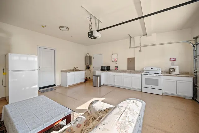 a large white room with cabinets