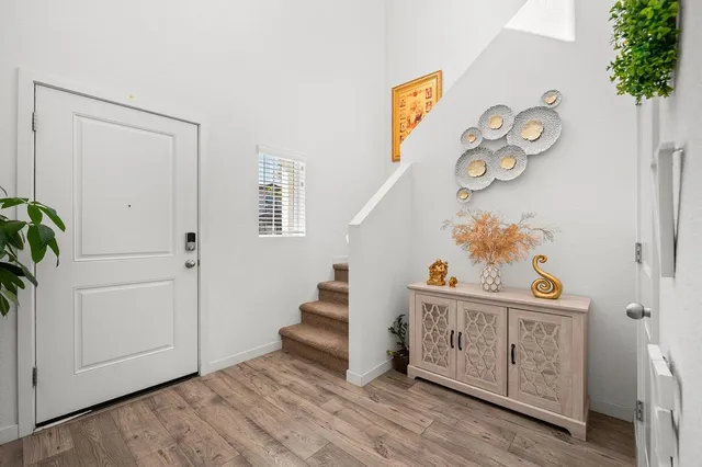 a view of an entryway with wooden floor