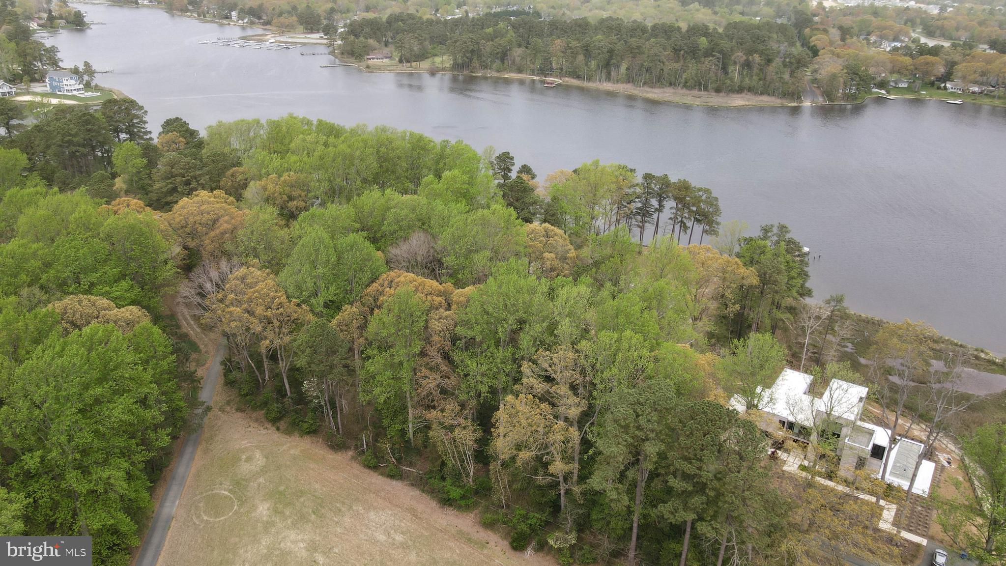 an aerial view of a houses with lake view