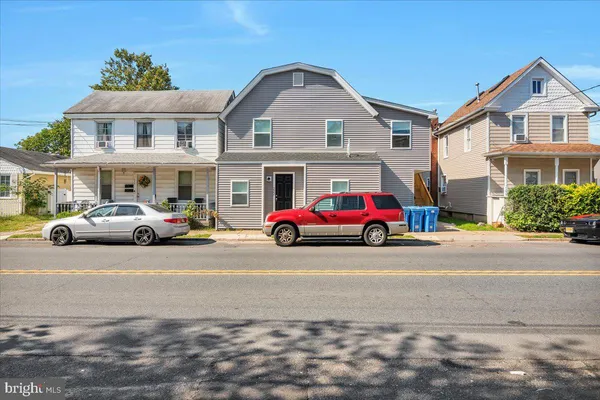 a parked cars parked in front of a house