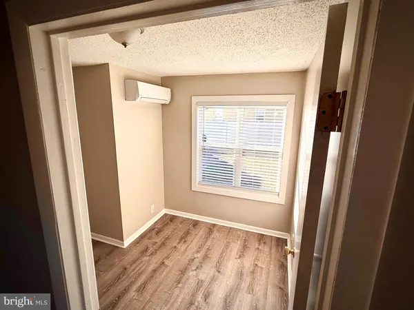 a bathroom with a sink and mirror with toilet
