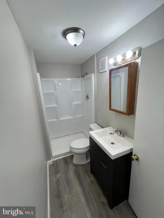 a kitchen with granite countertop a sink and a stove top oven